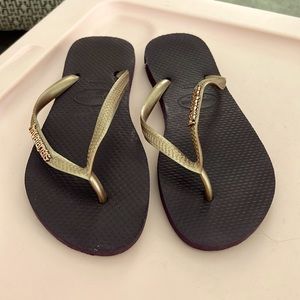 Havaiana slim gold flip flops.